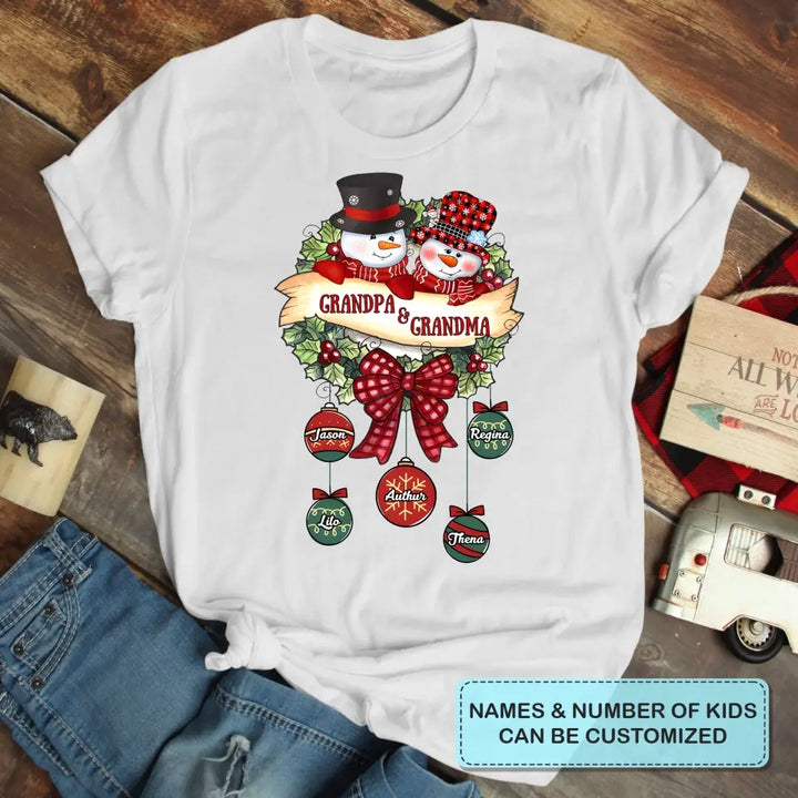 Snowman Grandma And Grandpa- Personalized Custom T-shirt - Christmas Gift For Grandma, Mom, Grandpa, Dad, Family Members